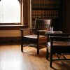 Quiet judge's chambers in a Texas courthouse with two chairs angled toward each other